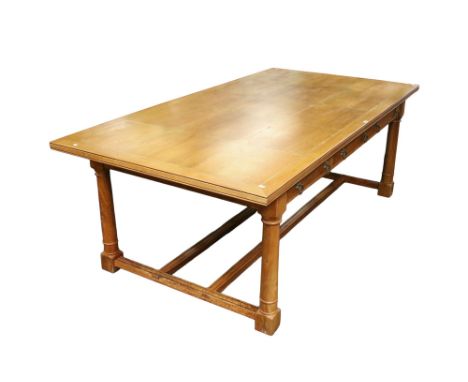 A large contemporary Flagstone Furniture wooden dining table. Having parquetry details to the top and six-drawer cannon legs.