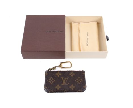 A Louis Vuitton key purse in original box. With dust bag, the purse measuring circa 6.5cm x 11.5cm. 