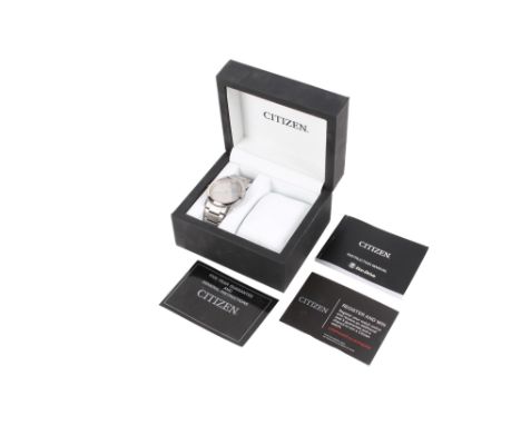 A Citizen Eco-drive Titanium gentleman's wristwatch. With documents, box and spare links.