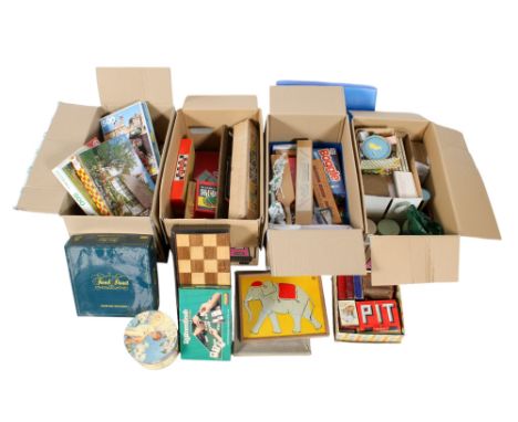 An assortment of vintage children's games. Including a chessboard, 'Woodland Snap' card game, boxed Trivial Pursuit, miniatur