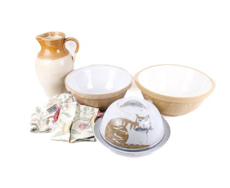 An assortment of stoneware pottery kitchenalia. Comprising a salt glazed jug marked '1 Gail', two mixing bowls and a cloche d