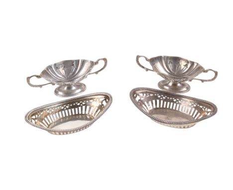 A pair of George V silver open salts and a pair of silver sweet dishes. The salts hallmarked Jones & Crompton, Birmingham 191