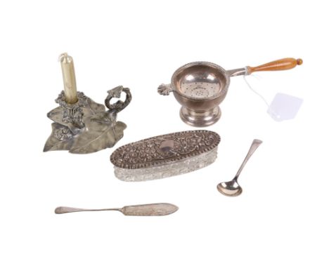 A small group of silver and white metal. Including a silver lidded glass trinket box, a small silver footed vessel, silver tr