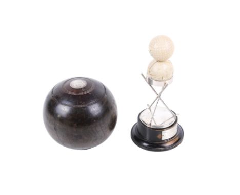 A silver inlaid lawn bowl and a golf ball trophy. The bowl engraved 'Kingston Bowling Club 1853' to one side and 'President's