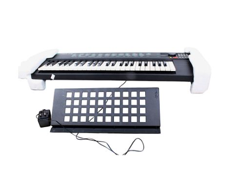 A Yamaha Portatone electronic piano keyboard. Model PSR-75, boxed. S/n. N 0106279