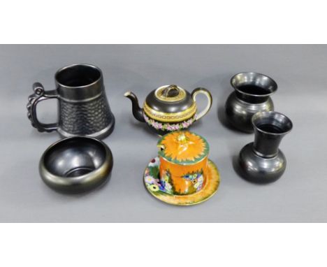 Mixed lot to include Carlton ware orange lustre jam jar cover and saucer, four black glazed vases etc., and a black glazed te