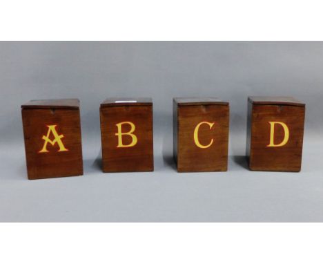 Set of four 19th century mahogany rectangular tea caddies with hinged lids and gilt red edged alphabet letters A, B, C &amp; 