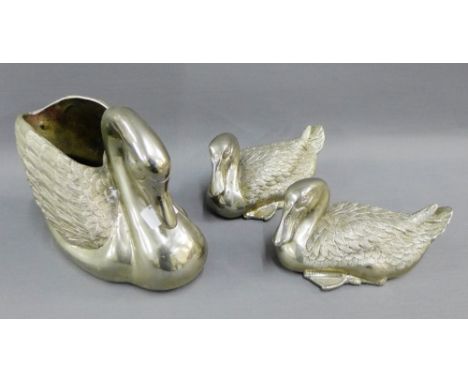 Pair of white metal duck figures, together with a large swan shaped planter, tallest 18cm, (3)