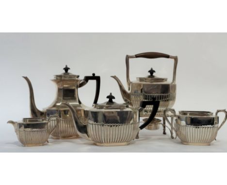 A late Victorian assembled five piece silver tea service, the teapot, coffee pot, cream and sugar hallmarked for London 1896 