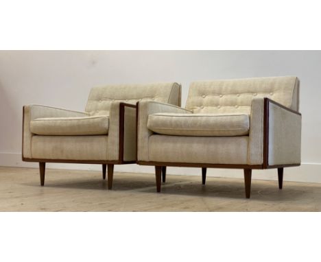 A pair of Danish 1960's lounge chairs, upholstered in ivory white chenille type button back fabric, with squab cushions, teak