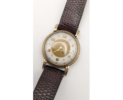 A mid 20th century 9ct gold gents 15 jewel manual wind wristwatch on a brown leather strap A/FLocation: 