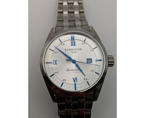 An Earnshaw automatic stainless steel wristwatch with a silver coloured face and blue baton dials with an exhibition back on 