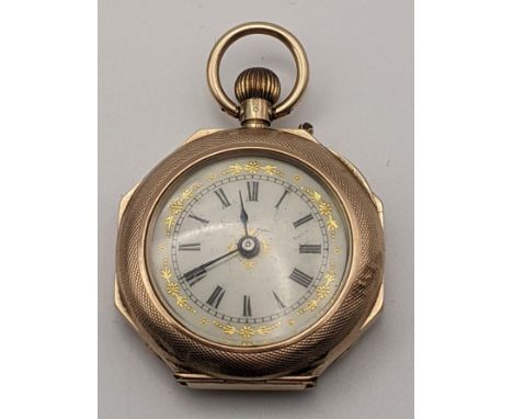 An early 20th century gold keyless wound ladies fob watch in an engine turned octagonal  case, London 1912, 19.4gLocation: 