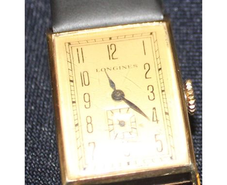 A Longines 14ct. gold gentleman's wrist watch, manual movement, having signed gold coloured rectangular Arabic numeral dial w