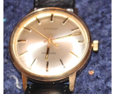 A 9ct. gold Garrard retailed Eterna gentleman's wrist watch,&nbsp;c.1970, manual wind, having signed silvered circular dial w