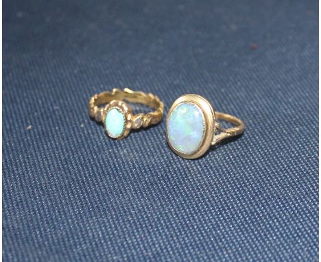 An 18ct. gold and opal dress ring, set oval cabochon opal, assayed London 1965, (gross weight 4.9g), together with a 19th cen