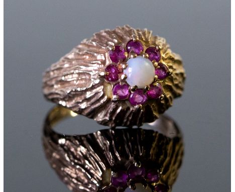 A 9ct gold, opal and ruby cocktail ring, London 1971, size N, approx 4.7gms, in a red Moroccan leather box