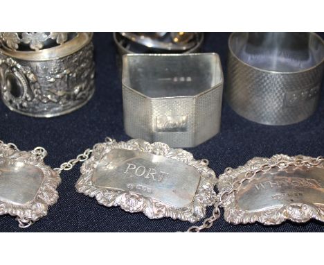 A set of three matched silver rectangular decanter labels, "Port", "Gin" and "Whisky", by different makers, assayed London 19