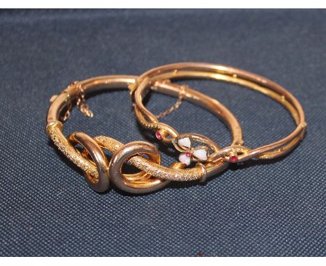 A Victorian 9ct. rose gold "knot" hinged bangle,&nbsp;part textured, (10.9g), together with another 9ct. rose gold "knot" hin