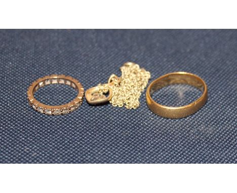 A 22ct. gold band, (6.1g), together with a 9ct. gold and synthetic spinel eternity ring, (one stone lacking), (gross weight 1