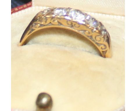 An 18ct. gold and diamond five stone ring, set five graduated old cut diamonds, shank stamped "18ct". (gross weight 3.1g),&nb