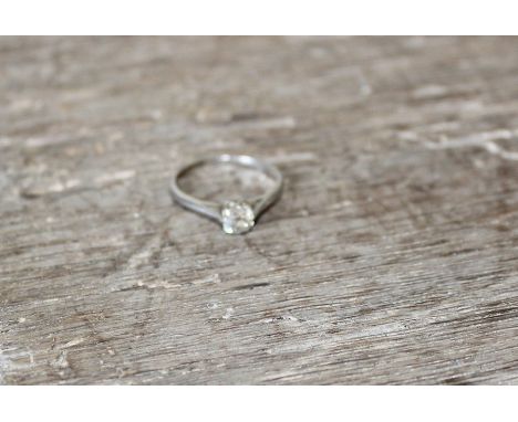 A Platinum and diamond solitaire ring, set old cut diamond (diamond weight approx. 0.4 carats). shank stamped "Plat". (gross 