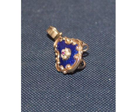 A 19th century precious yellow metal and enamel mourning pendant/brooch, having dark blue enamelled pear shaped mount with 'C