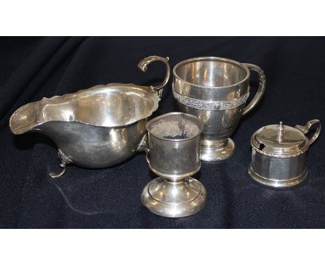 A silver cup, by Roberts &amp; Dore, assayed Birmingham 1939, with raised Celtic knot band and loop handle, together with a s