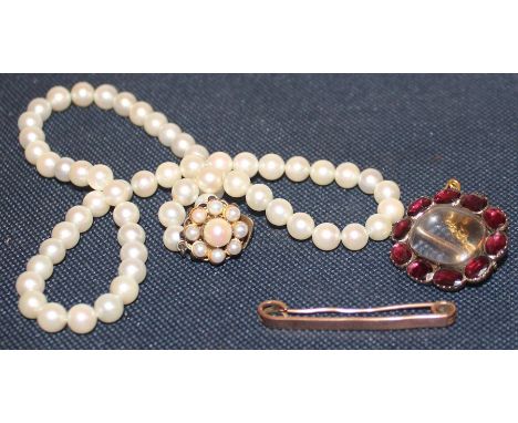 A cultured pearl choker necklace,&nbsp;with pierced circular yellow metal clasp set cultured pearls, (yellow metal assessed a