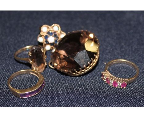 A&nbsp;9ct. gold, opal and sapphire cluster ring, having flower form wire work mount set round cabochon opal to raised centre