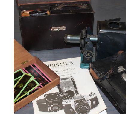 a 19th cent plate camera and later cameras including a magic lantern and slides