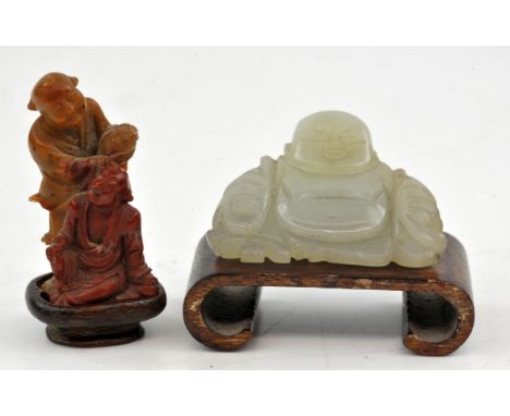 Two Chinese miniature stone sculptures , Republic period. To include a seating Jade buddha on a wooden stand 3.5 cm high , an