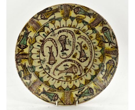 A North-East Iran Charger, probably Nishapur 10th century. The buff ceramic Interior painted with fishes, the cavetto decorat