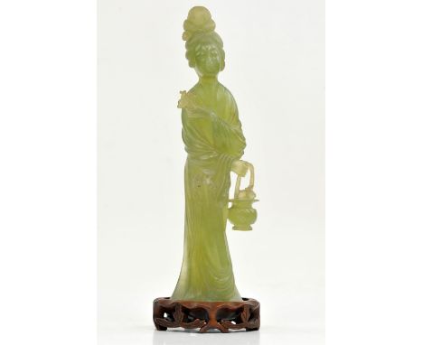A Jade Sculpture of a Lady , Republic period. The standing lady holding in one hand a basket with peaches on the top , and a 