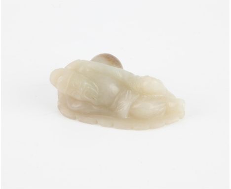 A Chinese jade figure of Lu Dongbin. Carved sleeping against a double gourd, 6.5cm