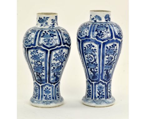 Chinese Blue and White Matched Pair of Vases, Kangxi period. The vases are decorated with three rows of cartouches enclosing 
