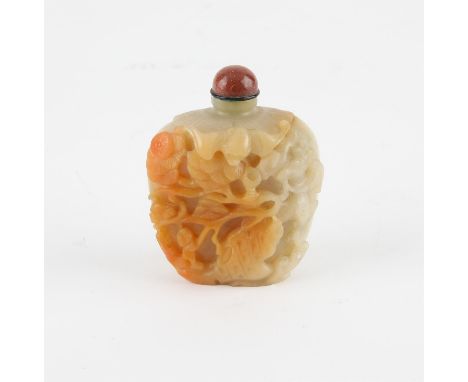 A Chinese pale greenish and russet jade snuff bottle. Finely carved with pine Tree, deer and a bat. 6 cm high with stopper.