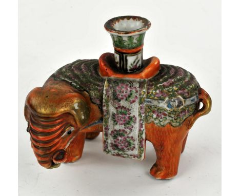 Chinese Export Canton Famille Rose Elephant Candle Holder, Qing dynasty, Circa 1860.  The standing elephant with trunk up is 