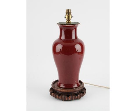 A Chinese Langyao oxblood vase mounted as lamp. Late Qing dynasty The baluster vase pierced at the base 33 cm high (vase) Con