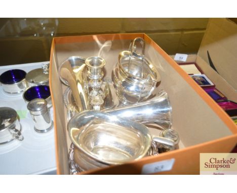 A plated chamber stick; a plated cream jug and sugar bowl; card tray; cruet items etc