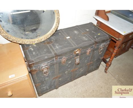 A metal bound storage trunk
