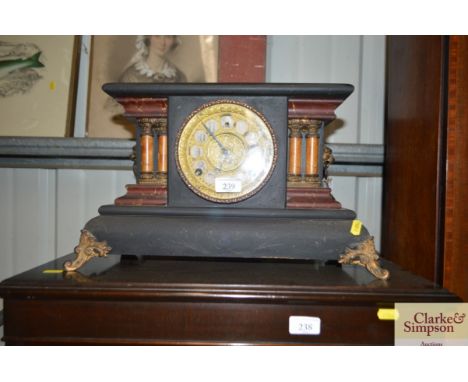 An American wooden mantel clock with lion head decoration
