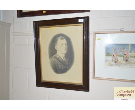 A framed military portrait print