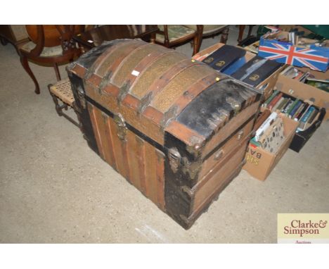 A Victorian domed travelling trunk with metal mounts 