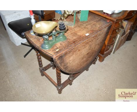 An oak barleytwist gate leg table 