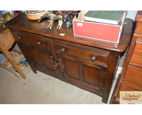 A dark Ercol dresser base