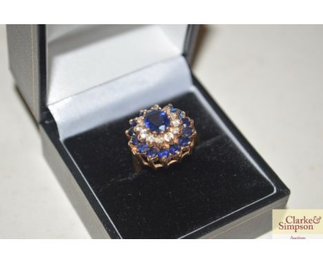 A 9ct gold sapphire and diamond cluster ring 