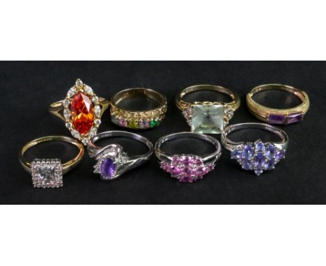 A collection of eight 9ct gold and yellow precious metal gem set dress rings including; a marquise fire opal and diamond ring