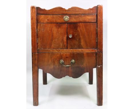 A George III mahogany tray top night commode, with cut-out carrying handles and pierced lozenges, enclosed by a pair of doors