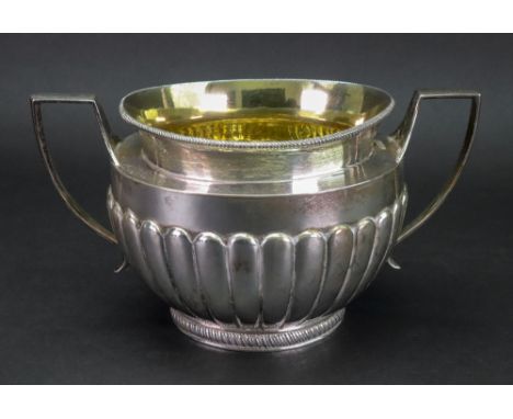 A Victorian circular silver sugar basin, Lambert Coventry Street, London 1881, with gadroon borders, twin harp side handles, 